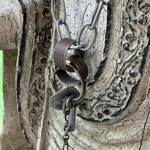 Layered Metal Charm Necklace in Aged Bronze and Silver Tones